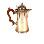 A silver coffee pot, in the George II style, the domed lid surmounted by a finial, scroll thumbpiece