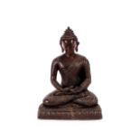 A Chinese bronze seated Buddha, 24cm high