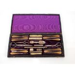A late Victorian cased silver part manicure set, including a double ended medicine spoon, pen knife,