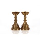 A pair of Victorian bell metal ecclesiastical candle sticks, in a plain 17th Century style, dished