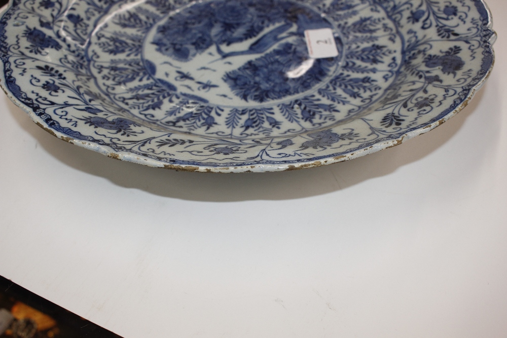 A pair of late 18th Century Delft chargers, central panel decorated with a ho ho bird, surrounded by - Image 13 of 19