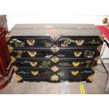 A Japanese style lacquered and gilt decorated chest, fitted eight drawers, having brass mounts