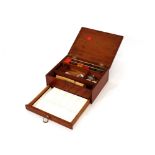 A Victorian mahogany artists paintbox, and contents with fitted drawer containing ceramic mixing
