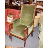 A 19th Century mahogany framed armchair, upholstered seat, back and armrests raised on reeded