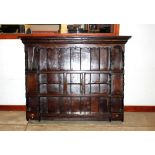 An oak dresser plate rack, shelved and with boarded back, fitted two small cupboards and two small