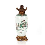 A Chinese Famille Verte pottery and Ormolu mounted table lamp, 28cm high