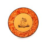 A 19th Century nursery plate, having cherub decoration within an orange sponged border, 18cm