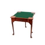 A George III mahogany triple fold over card and tea table, fitted single drawer raised on lappet