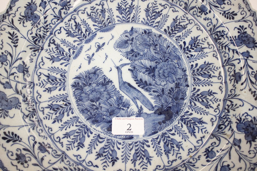 A pair of late 18th Century Delft chargers, central panel decorated with a ho ho bird, surrounded by - Image 11 of 19