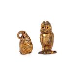 A small gilded metal vesta case, in the form of an owl with glass eyes; and a small brass vesta in