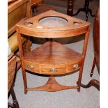 A 19th Century mahogany and boxwood strung two tier corner wash stand, raised on out swept