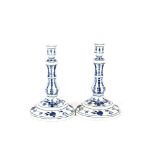 A pair of Meissen "Onion" pattern candlesticks, 24cm high