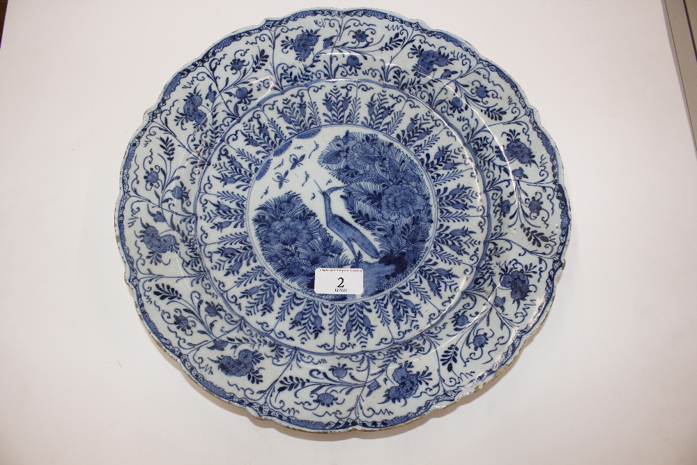 A pair of late 18th Century Delft chargers, central panel decorated with a ho ho bird, surrounded by - Image 10 of 19