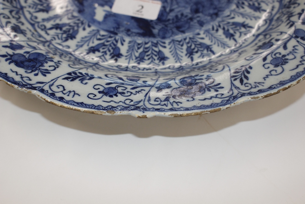 A pair of late 18th Century Delft chargers, central panel decorated with a ho ho bird, surrounded by - Image 4 of 19