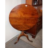 A 19th Century circular oak snap top occasional table, raised on baluster column and tripod base,