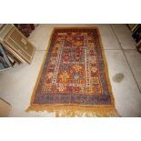 A Middle Eastern flat weave rug, on predominately orange ground with stylised floral decoration,
