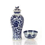 A Chinese blue and white porcelain baluster vase, the lid surmounted by a Kylin finial, decorated