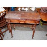 A 19th Century mahogany card table, raised on ring turned tapering supports terminating in