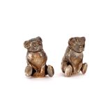 A pair of white metal pepperettes, in the form of seated Teddy Bears