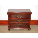 A mahogany three drawer trinket chest, raised on bun feet, 36cm wide x 21cm deep x 30cm high