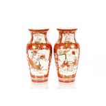 A pair of Kutani baluster vases, decorated exotic garden scenes with birds and foliage heightened in