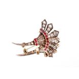 A yellow metal diamond and ruby set spray brooch, of cornucopia shape