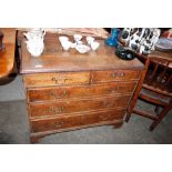 A Georgian oak chest, fitted two short and three long drawers, raised on bracket feet 93cm wide