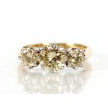 A Hallmarked 18ct gold three stone diamond ring, the central stone approx. ¾carat, the two side