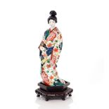 An oriental Imari patterned figure of a lady, raised on unassociated plinth, 32cm high