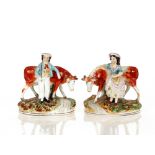 A pair of Victorian Staffordshire cow figures, with attendant herdsman and milkmaid, 16cm long, 17cm
