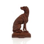 A Victorian cast iron and mottled doorstop, in the form of a hound or gundog on projecting moulded