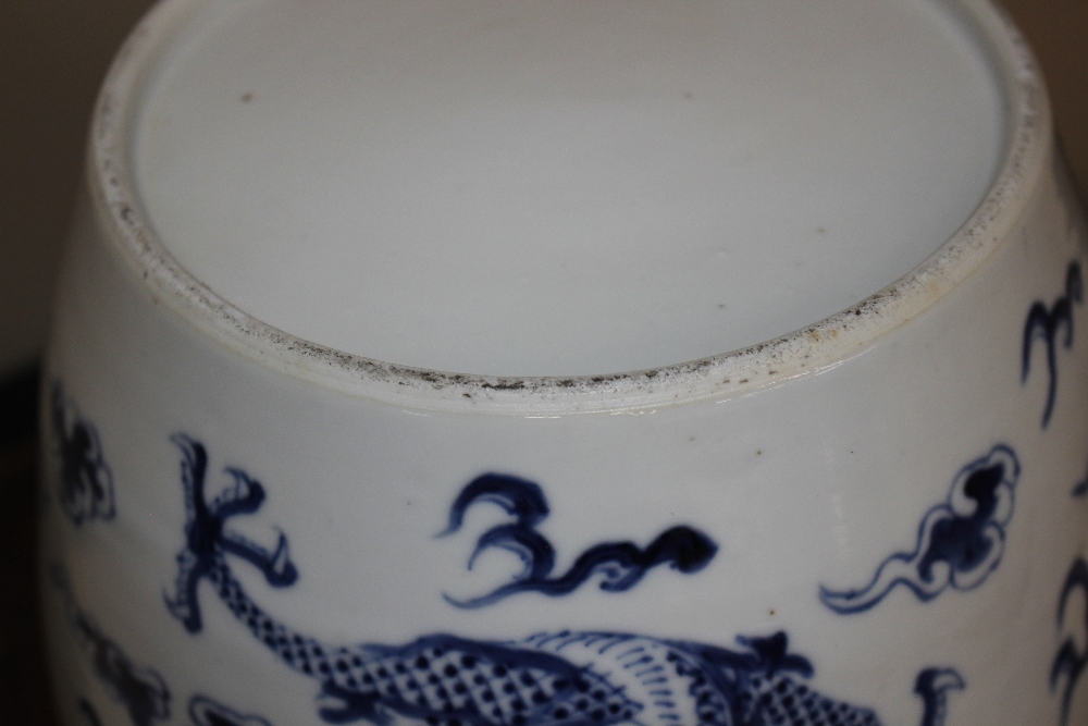 A pair of 19th Century Chinese blue and white porcelain jars, profusely decorated dragon, clouds and - Image 5 of 5
