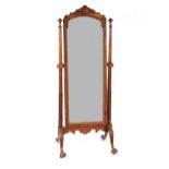 A 19th Century style mahogany cheval mirror, supported by turned fluted and blind fret columns,