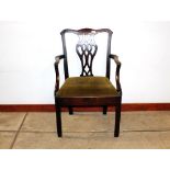 A 19th Century mahogany Chippendale design elbow chair, having pierced central back splat,