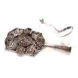 An antique Dutch silver hand mirror, lacking glass; and an antique Dutch silver love spoon (2)