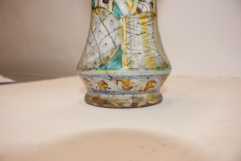 A glazed earthenware albarello, decorated with an oval panel of a priest surrounded by foliate - Image 5 of 8