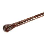 A hardwood walking stick, having white metal inlaid decoration