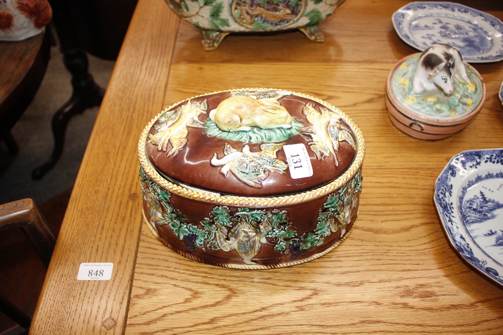 A Minton Majolica game pie dish and cover, decorated gun dog and shooting apparel to the lid, the - Image 10 of 32