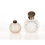 A late Victorian cut glass globular scent bottle, with silver mount and lid, having whorled