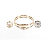 A 9ct gold ring with pierced link decoration; and a similar design bangle, 8gms; and a 9ct white