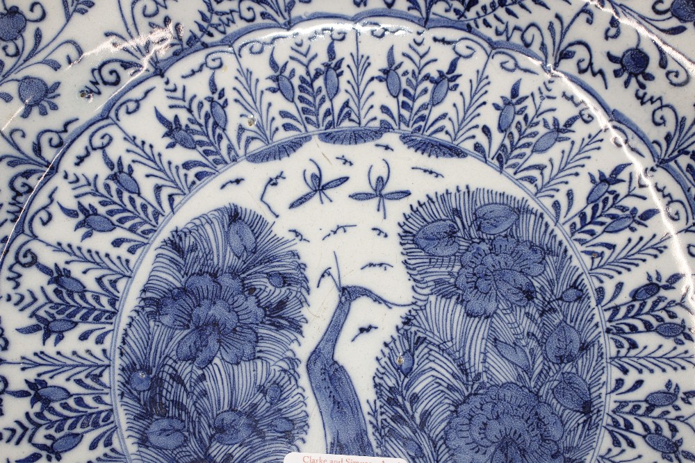 A pair of late 18th Century Delft chargers, central panel decorated with a ho ho bird, surrounded by - Image 3 of 19