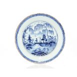 A late 18th Century Delft ware plate, decorated in the Chinese manner, 30cm dia.