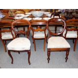 A set of six Victorian mahogany cabriole legged dining chairs, having upholstered stuff over seats