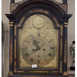 A late 18th Century lacquered and chinoiserie decorated long case clock, the hood surmounted by a