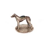 A small silver pin cushion, in the form of a greyhound on circular base