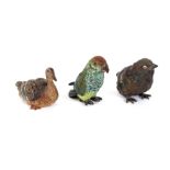 A cold painted bronze parrot, a cold painted bronze duck; and another of a chick (3)