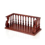 A mahogany book carrier, in the Regency style, the three quarter gallery united by balustrades and