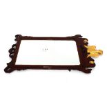 A George III mahogany fret carved wall mirror, in the Chippendale manner, surmounted by gilt eagle