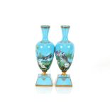A fine pair of 19th Century French blue opaque glass vases, with enamelled decoration of birds and