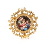 A Berlin type porcelain plaque, depicting Madonna and Child in Florentine gilt frame, the panel 14.